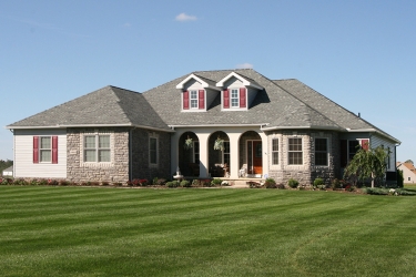 beautiful custom home with arched porch