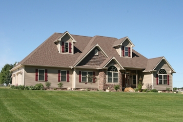 custom home with high pitch roof by gatliff custom builders