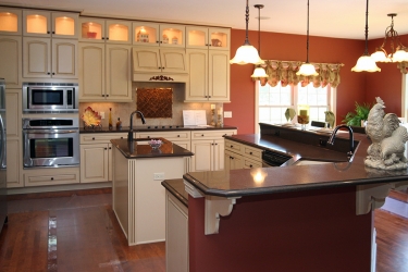 custom kitchen with excellent color tones and gathering zone