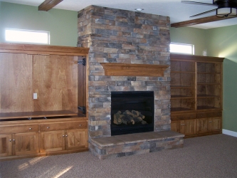 lower level family room with stone fireplace