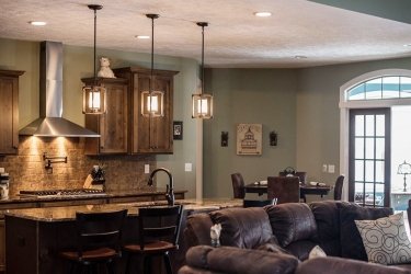 open kitchen with island and darker finish