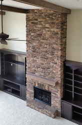 overlooking custom floor to ceiling fireplace by gatliff custom homes