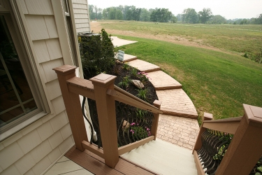 attractive side porch with decorated sidewalk