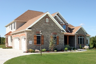 two story custom home with copper accents