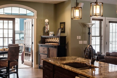 view from kitchen to sunroom custom home by gatliff custom homes